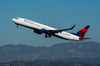 Delta Airlines Boeing 737-900 departs LAX