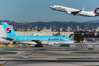 Image: An Alaska 737 departs while a Korean A380 taxis at LAX