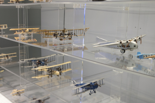 Image: Installation view of "Aviation Evolutions: The Jim Lund 1:72 Scale Model Airplane Collection"