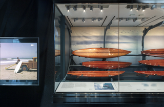 Image: Installation view of "Reflections in Wood – Surfboards & Shapers"