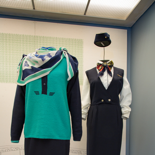 Installation view of "Fashion in Flight: A History of Airline Uniform Design"