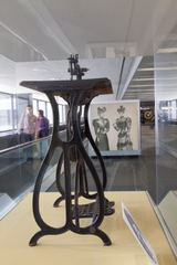 Image: Installation view of "Threading the Needle: Sewing in the Machine Age"