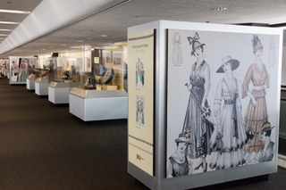 Image: Installation view of "Threading the Needle: Sewing in the Machine Age"