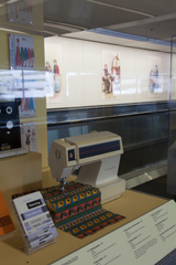 Image: Installation view of "Threading the Needle: Sewing in the Machine Age"