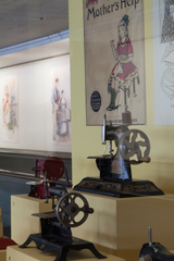 Image: Installation view of "Threading the Needle: Sewing in the Machine Age"