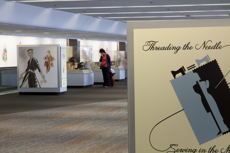 Image: Installation view of "Threading the Needle: Sewing in the Machine Age"