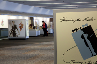 Image: Installation view of "Threading the Needle: Sewing in the Machine Age"