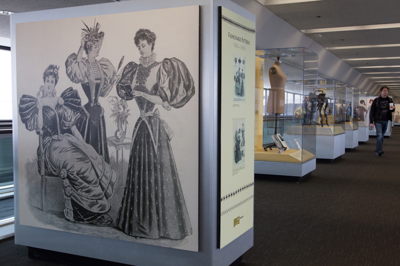 Image: Installation view of "Threading the Needle: Sewing in the Machine Age"