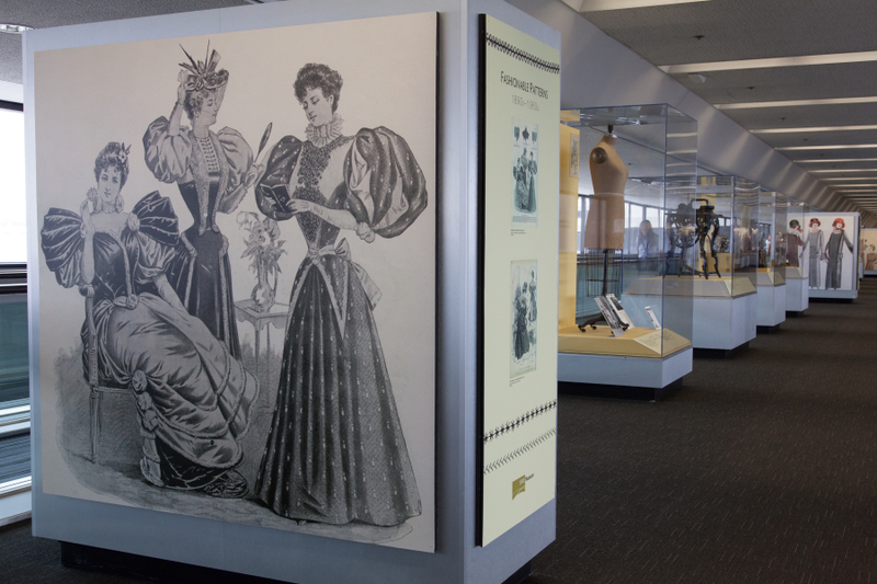 Image: Installation view of "Threading the Needle: Sewing in the Machine Age"