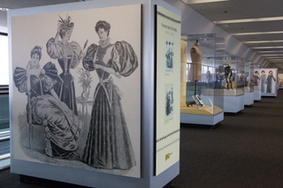 Image: Installation view of "Threading the Needle: Sewing in the Machine Age"