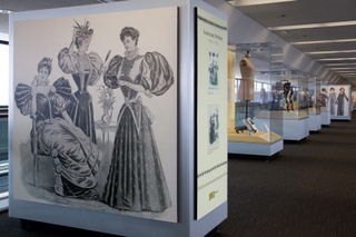 Image: Installation view of "Threading the Needle: Sewing in the Machine Age"