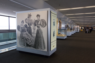 Image: Installation view of "Threading the Needle: Sewing in the Machine Age"