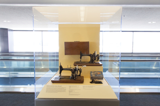 Image: Installation view of "Threading the Needle: Sewing in the Machine Age"