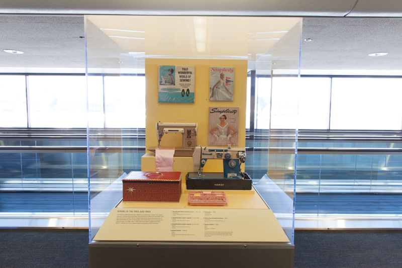 Image: Installation view of "Threading the Needle: Sewing in the Machine Age"