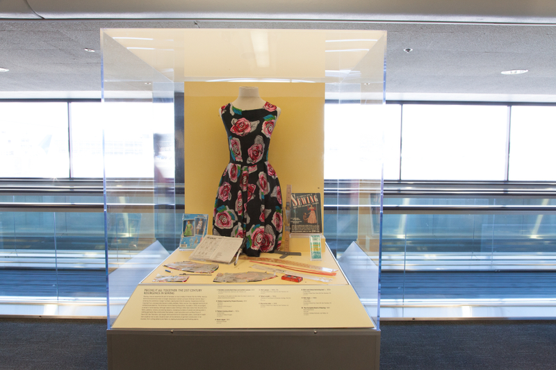 Image: Installation view of "Threading the Needle: Sewing in the Machine Age"