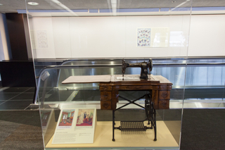 Image: Installation view of "Threading the Needle: Sewing in the Machine Age"