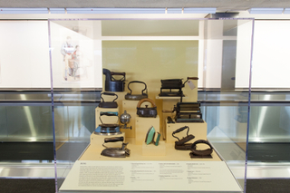 Image: Installation view of "Threading the Needle: Sewing in the Machine Age"