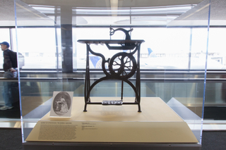 Image: Installation view of "Threading the Needle: Sewing in the Machine Age"
