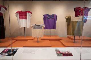 Image: Installation view of "Empowering Threads: Textiles of Jolom Mayaetik"