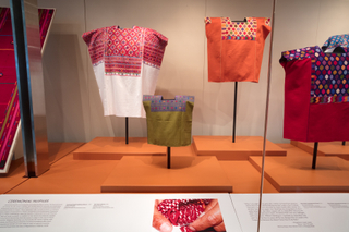 Image: Installation view of "Empowering Threads: Textiles of Jolom Mayaetik"