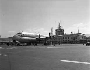 Image: negative: San Francisco Airport, Administration Building and U.S. Navy Lockheed ‘Constitution’