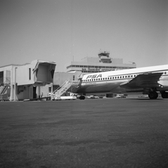Image: negative: San Francisco International Airport (SFO), Pacific Southwest Airlines (PSA) jetway and aircraft