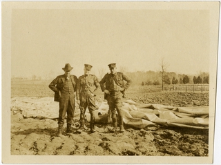 Image: photograph: San Francisco Bay Area, three men in field