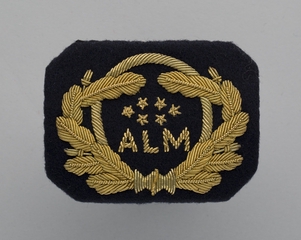 flight officer cap badge: Dutch Antillean Airlines (ALM)
