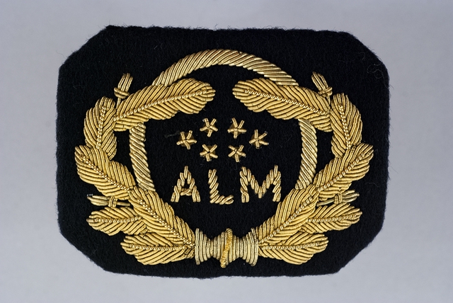 Flight officer cap badge: ALM Antillean Airlines