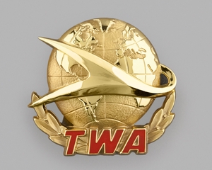 Image: flight officer cap badge: TWA (Trans World Airlines)