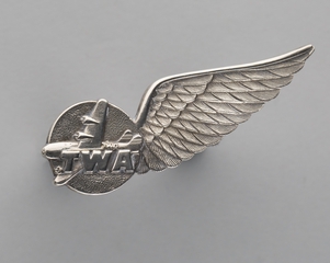 Image: air hostess hat badge: Transcontinental & Western Air (TWA)