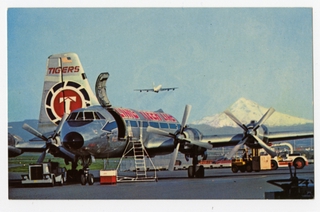 Image: postcard: Flying Tiger Line, Canadair Swingtail CL-44, Portland Oregon Airport