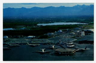 Image: postcard: Anchorage International Airport, Alaska Airlines, Flying Tiger Airlines, Boeing 727, Convair 990, Lockheed Constellation, Boeing 707