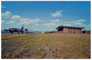 Image: postcard: West Yellowstone Airport, Lockheed L-188 Electra, Western Airlines