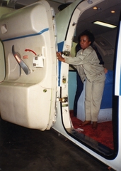 Image: photograph: United Air Lines, safety photos, evacuation test