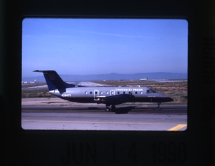 Image: slide: United Express, Embraer EMB-120 Brasilia, San Francisco International Airport (SFO)