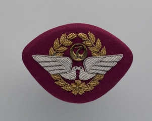 Image: flight officer cap badge: JAL Cargo (Japan Airlines)