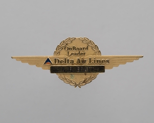 Image: flight attendant wings and name pin: Delta Air Lines, A.R. Bratt