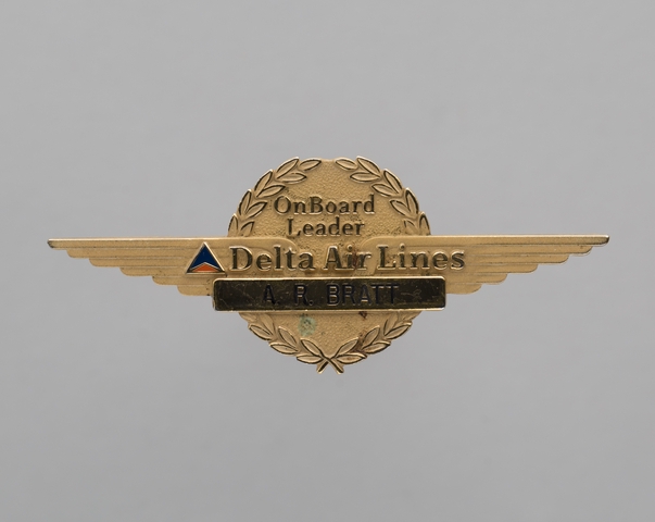 Flight attendant wings and name pin: Delta Air Lines, A.R. Bratt