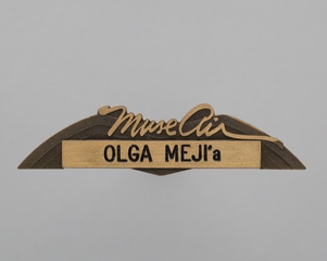Image: flight attendant wings and name pin: Muse Air, Olga Meji’a