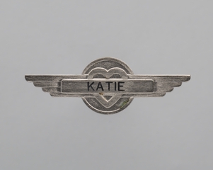 Image: flight attendant wings and name pin: Southwest Airlines, Katie
