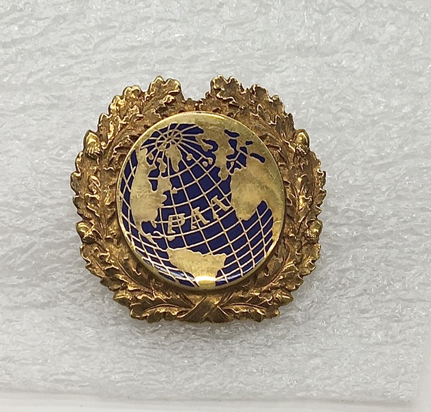 Image: flight officer cap badge: Pan American World Airways