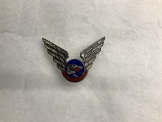 Image: flight officer hat badge: Flying Tiger Line