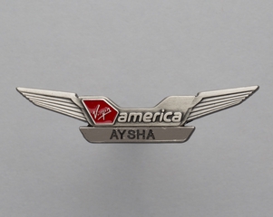 Image: flight attendant wings and name pin: Virgin America, Aysha