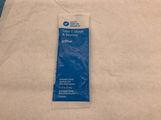 Image: sanitizing gel and towel packet: JetBlue Airways