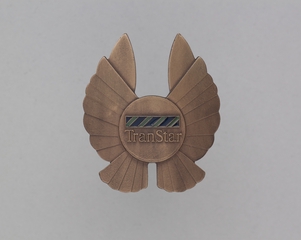 Image: flight officer cap badge: TranStar Airlines