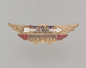 Image: flight officer cap badge: TAT (Transcontinental Air Transport) and Maddux Air Lines