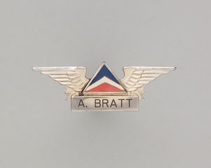 Image: flight attendant wings and name pin: Delta Air Lines, A. Bratt