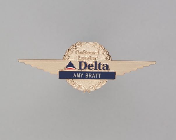 Flight attendant wings and name pin: Delta Air Lines, Amy Bratt