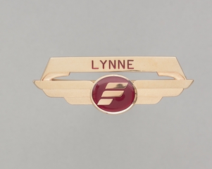 Image: flight attendant wings and name pin: Frontier Airlines, Lynne